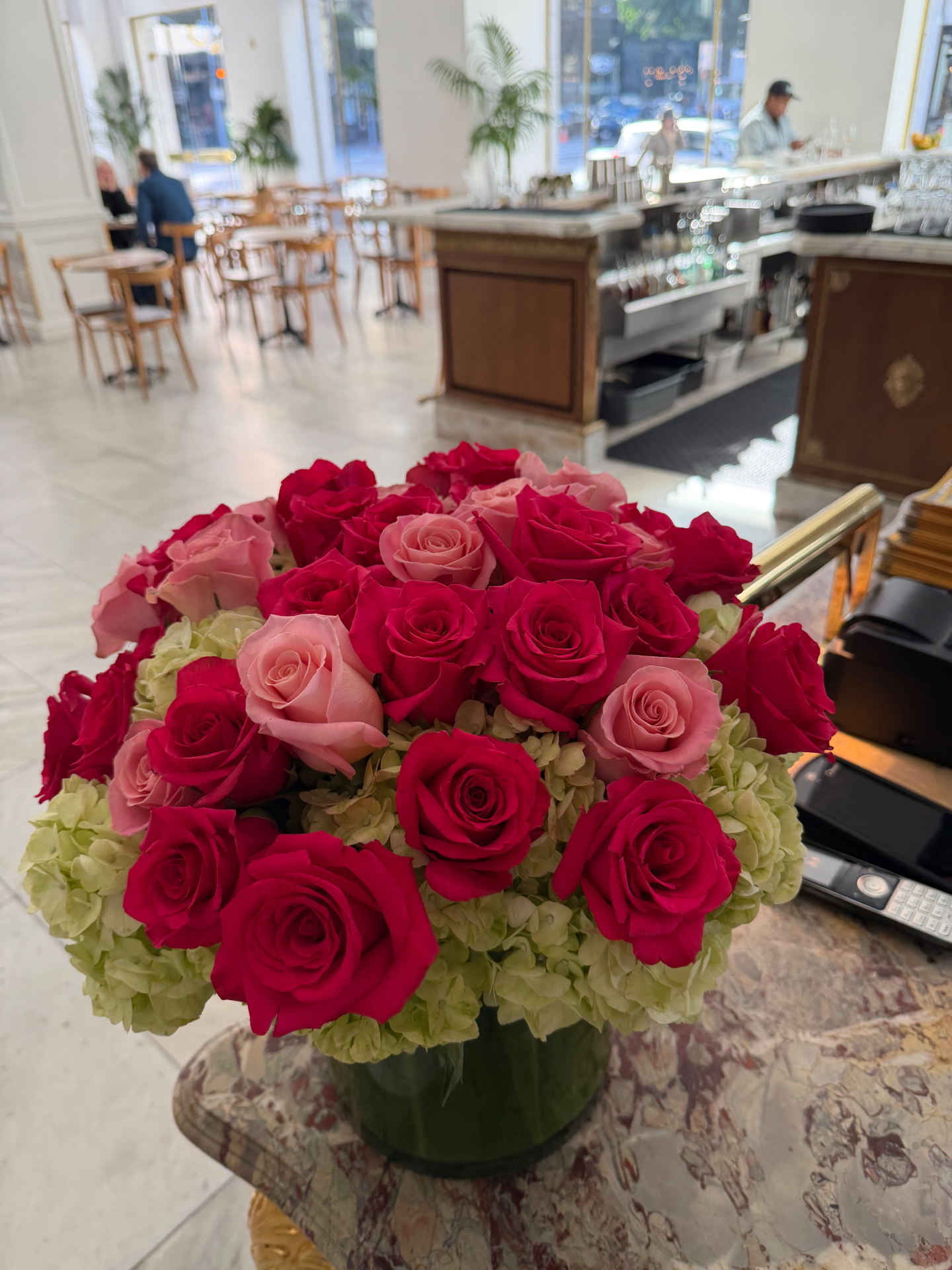 Weekly restaurant floral arrangement delivered by Blossom Logistics Co.